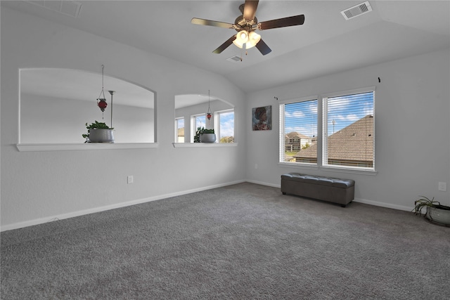 carpeted spare room featuring ceiling fan and lofted ceiling