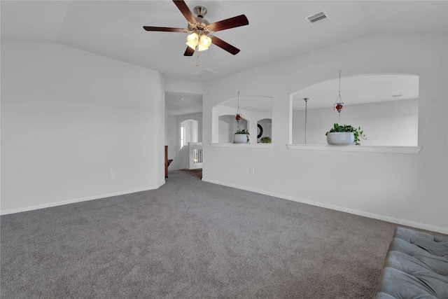 unfurnished living room featuring carpet flooring, ceiling fan, and vaulted ceiling