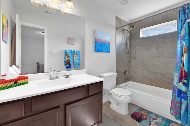 full bathroom featuring tile patterned flooring, shower / bath combo, toilet, and vanity