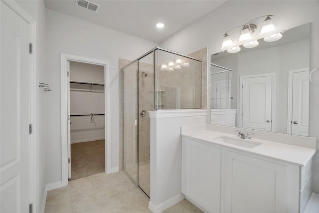 bathroom featuring vanity and walk in shower