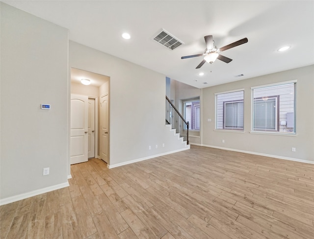 unfurnished living room with ceiling fan and light hardwood / wood-style flooring