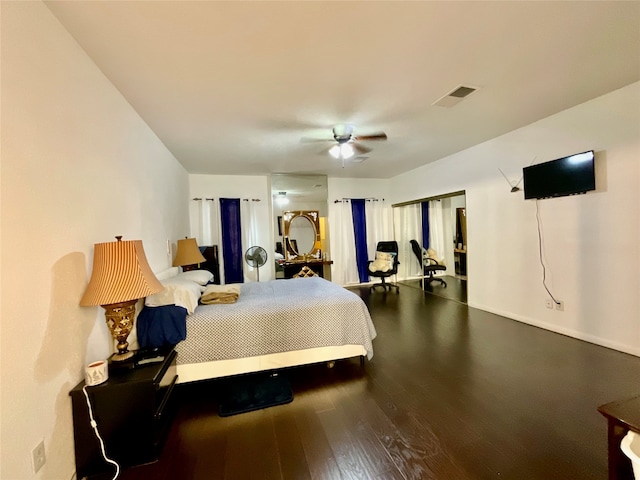 bedroom with ceiling fan and hardwood / wood-style floors