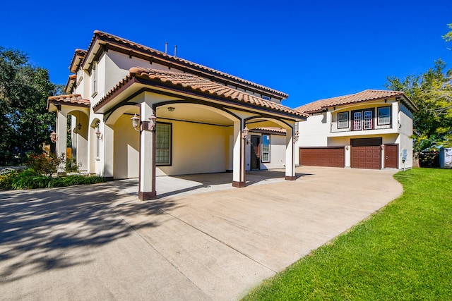 mediterranean / spanish-style house featuring a garage