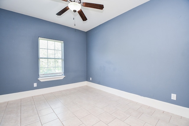 unfurnished room with ceiling fan and light tile patterned floors