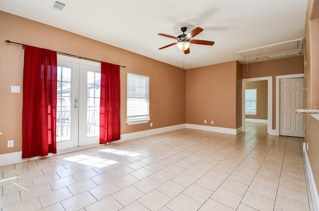 tiled empty room with french doors and ceiling fan