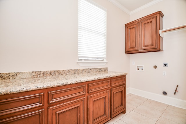 laundry area with cabinets, washer hookup, hookup for an electric dryer, gas dryer hookup, and crown molding