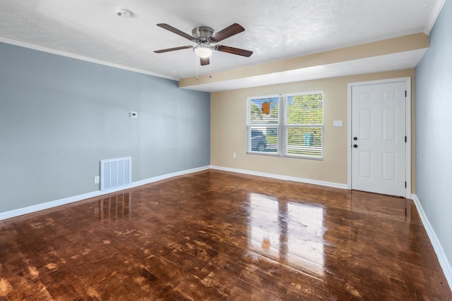 unfurnished room featuring ceiling fan, dark hardwood / wood-style flooring, a textured ceiling, and ornamental molding