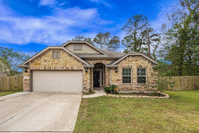 view of front of house with a garage and a front lawn