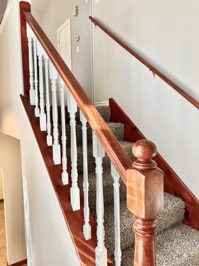 stairs with hardwood / wood-style flooring