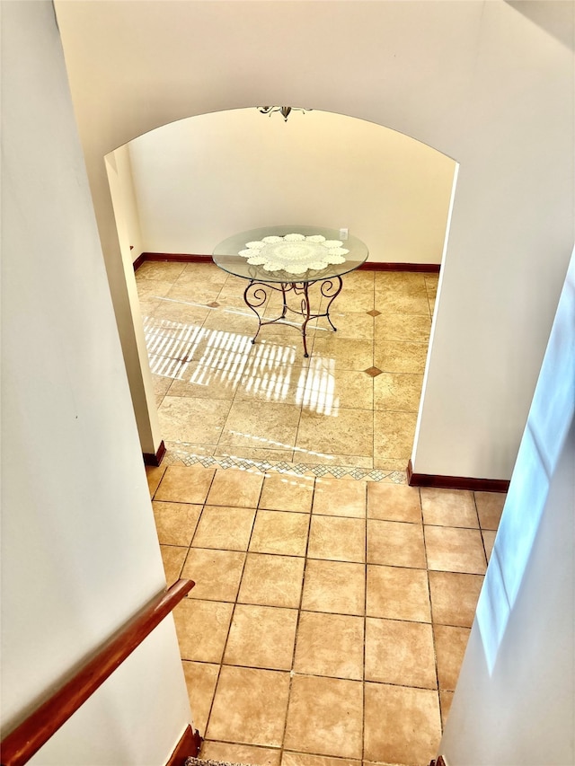 hallway featuring tile patterned flooring