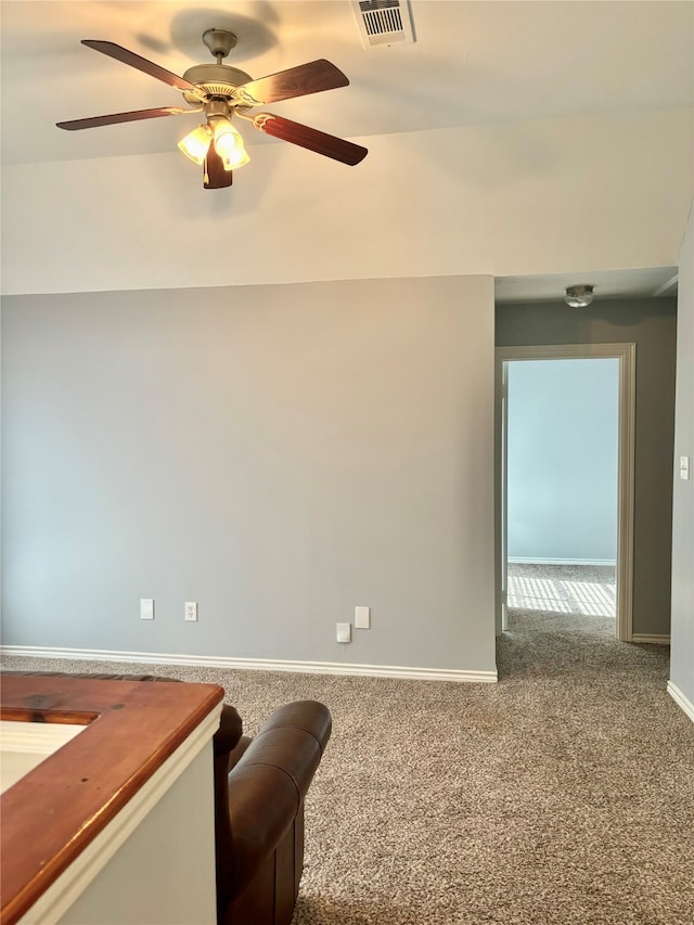 interior space with ceiling fan