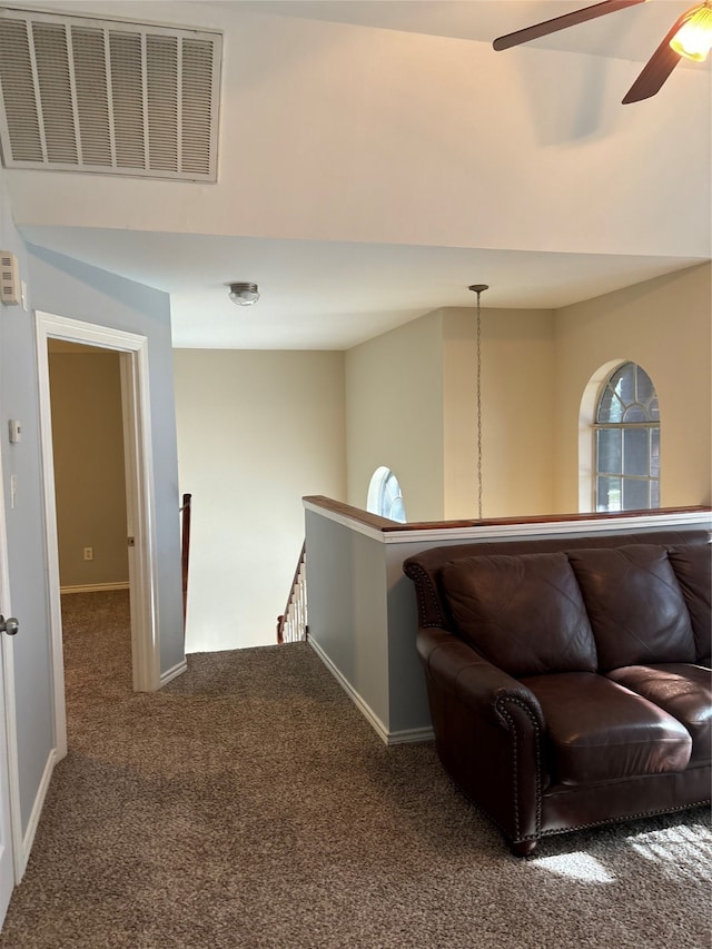 interior space featuring dark colored carpet