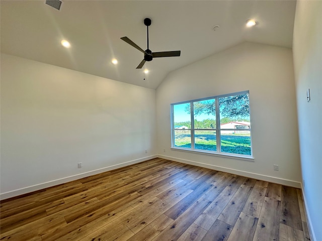 spare room with ceiling fan, light hardwood / wood-style floors, and lofted ceiling