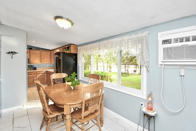 dining area featuring a textured ceiling and lofted ceiling