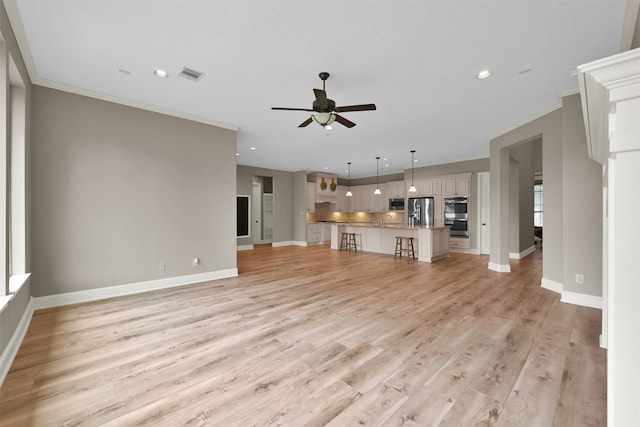 unfurnished living room with ceiling fan, light hardwood / wood-style flooring, and crown molding