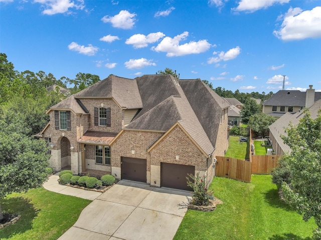 view of front of house featuring a front yard and a garage