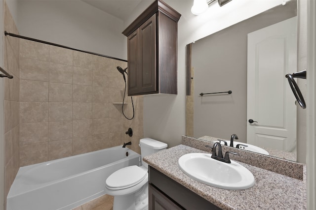 full bathroom with toilet, tile patterned floors, tiled shower / bath, and vanity