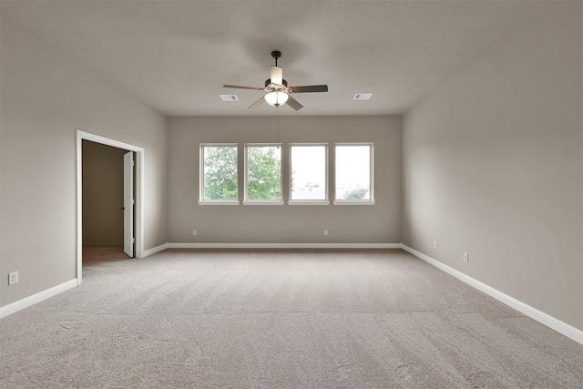 carpeted empty room with ceiling fan