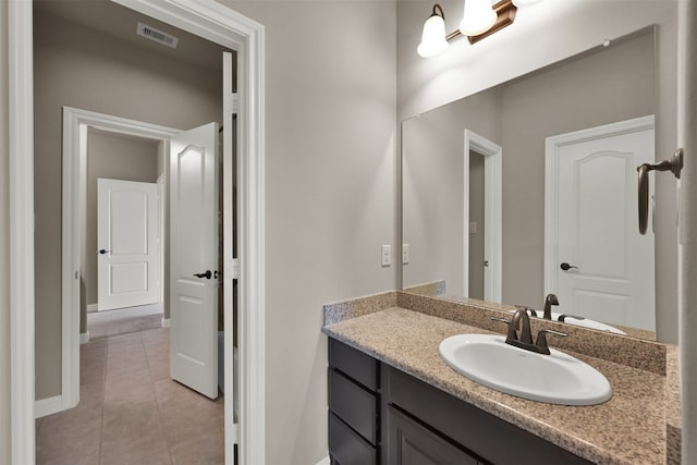 bathroom with vanity and tile patterned floors