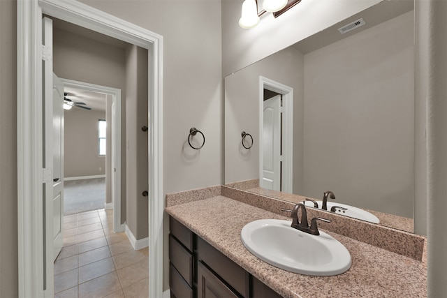 bathroom with tile patterned flooring and vanity