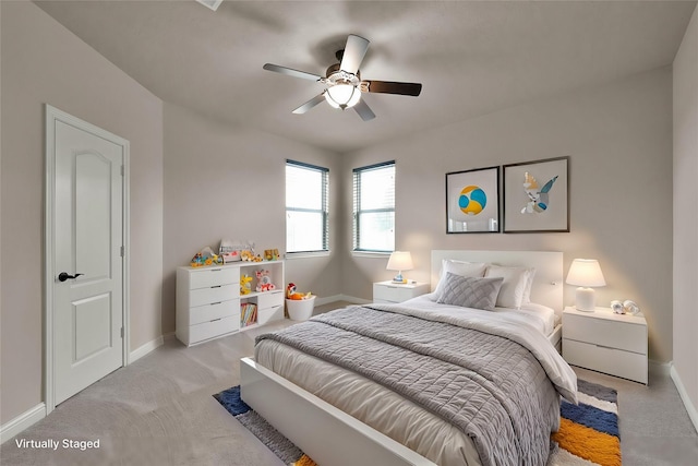 carpeted bedroom with ceiling fan