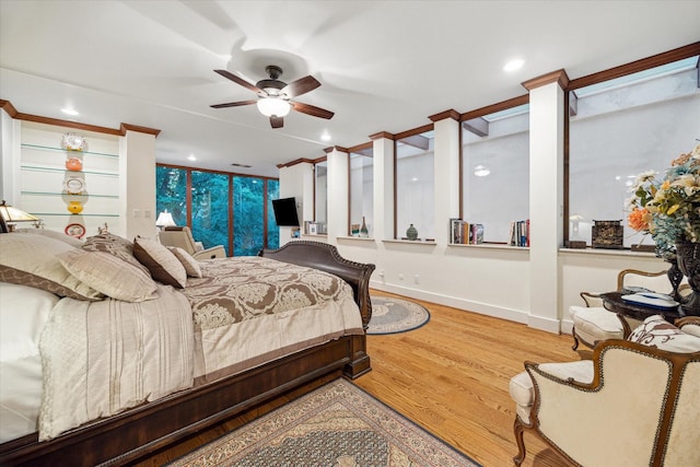 45 Briar Hollow Ln Unit 4, Houston, TX 77027 - bedroom with wood finished floors, recessed lighting, crown molding, and a ceiling fan