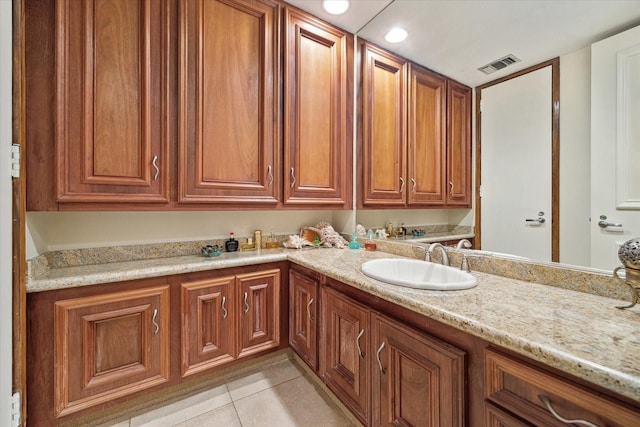 45 Briar Hollow Ln Unit 4, Houston, TX 77027 - bathroom with tile patterned floors, double vanity, and recessed lighting