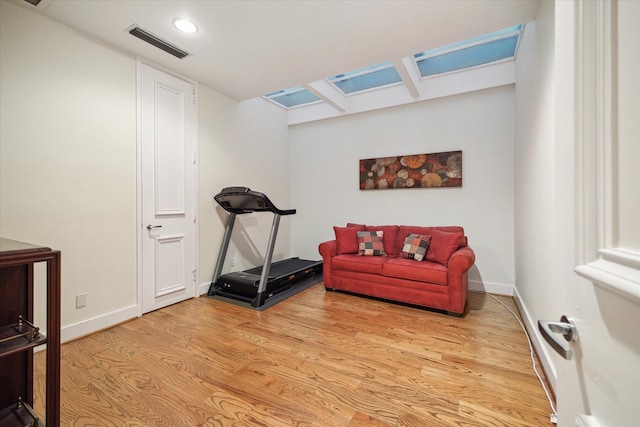 workout area featuring light wood-type flooring