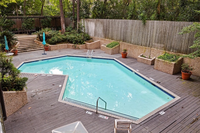 view of swimming pool featuring a deck