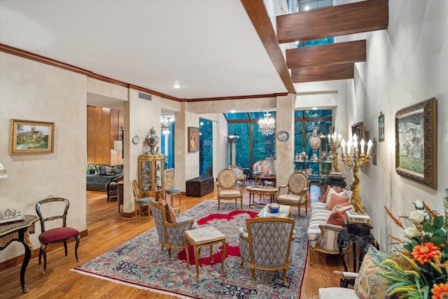 living room featuring light hardwood / wood-style flooring and ornamental molding