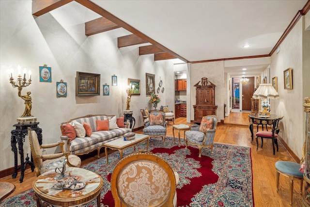 living room with light hardwood / wood-style flooring and beamed ceiling