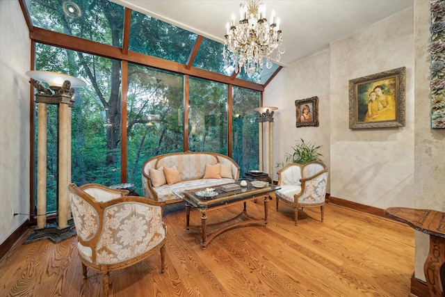 interior space with wood-type flooring, high vaulted ceiling, and a chandelier