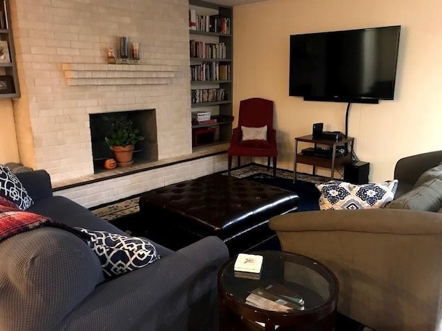 living room featuring a fireplace and built in features