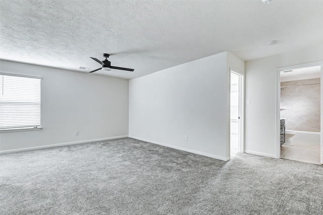 25342 Trinity Oakley Ct, Katy, TX 77493 - carpeted empty room with ceiling fan, a textured ceiling, and baseboards