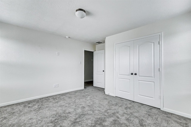 25342 Trinity Oakley Ct, Katy, TX 77493 - unfurnished bedroom with carpet flooring, baseboards, and a closet