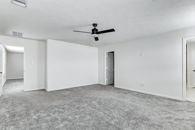 25342 Trinity Oakley Ct, Katy, TX 77493 - empty room featuring carpet floors, a ceiling fan, baseboards, and a textured ceiling