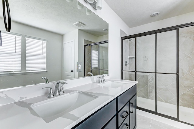 25342 Trinity Oakley Ct, Katy, TX 77493 - full bath with a stall shower, double vanity, tile patterned flooring, and a textured ceiling