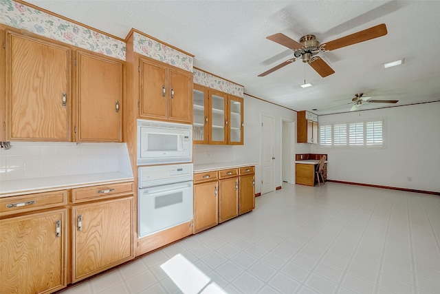 kitchen featuring ceiling fan, white appliances, a textured ceiling, and tasteful backsplash