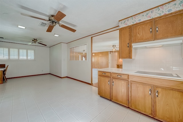 kitchen with tasteful backsplash, ceiling fan, ornamental molding, and black electric cooktop