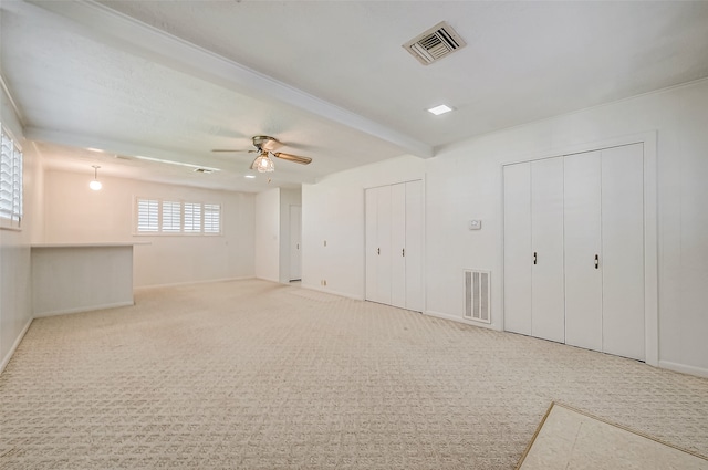 basement with carpet flooring and ceiling fan