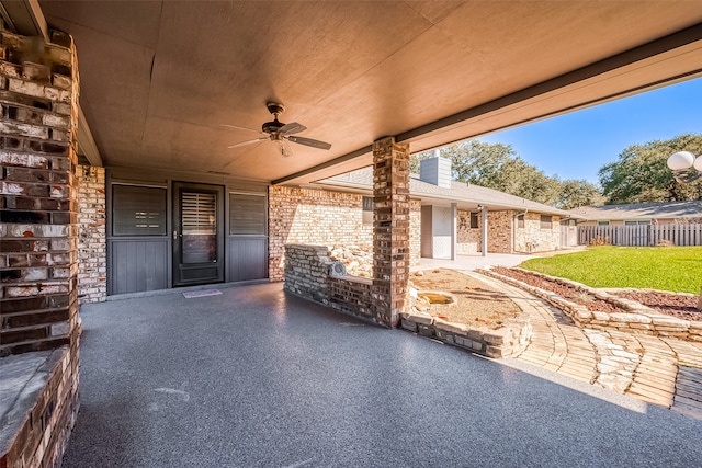 view of patio featuring ceiling fan