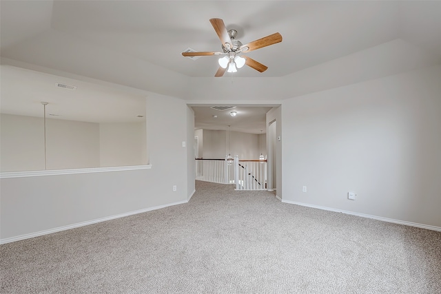 unfurnished room featuring ceiling fan and carpet floors