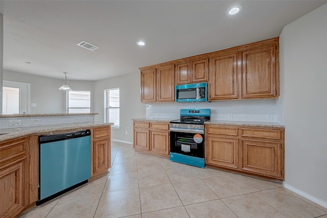 kitchen featuring decorative backsplash, appliances with stainless steel finishes, hanging light fixtures, and light tile patterned flooring