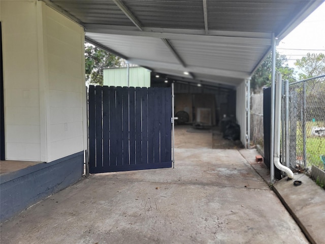 view of patio featuring a gate and fence