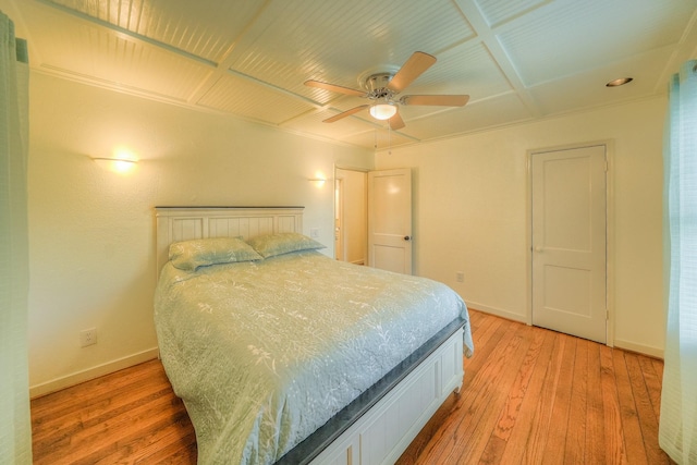 bedroom with ceiling fan and light hardwood / wood-style floors