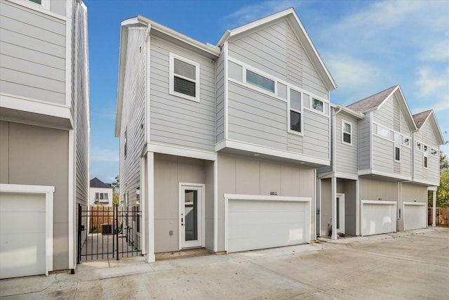 multi unit property featuring a garage