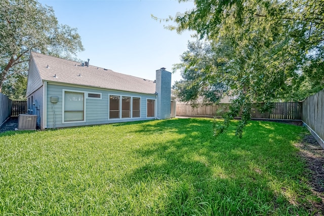 view of yard featuring central AC