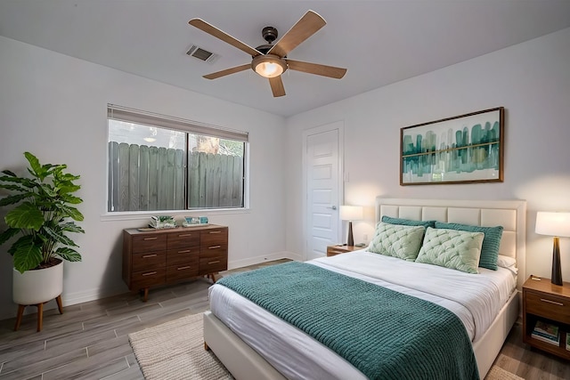 bedroom featuring light hardwood / wood-style floors and ceiling fan