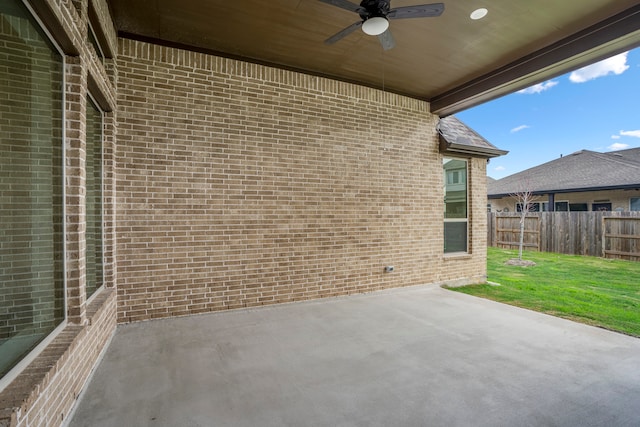 view of patio featuring ceiling fan