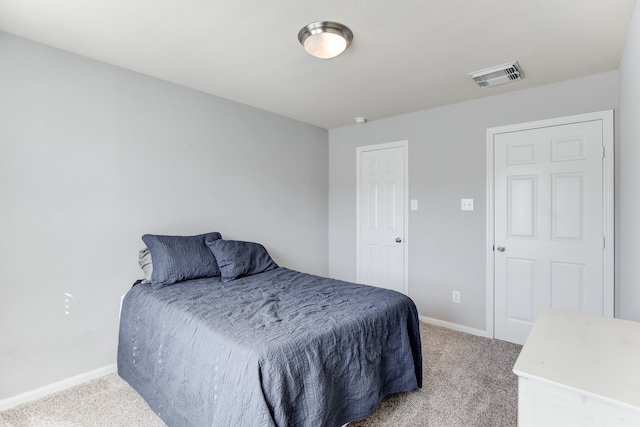 bedroom with light colored carpet